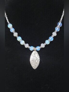 Handcrafted Opalescent Bead Necklace with Sparkling Silver Pendant.
